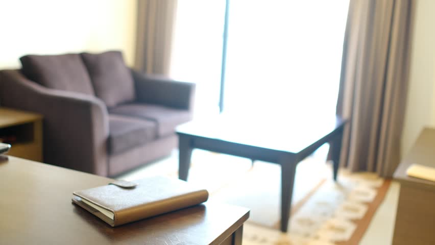 Asian Muslim woman take and reading book at home