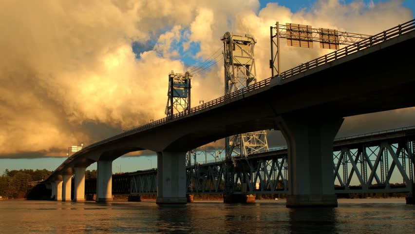 A time lapse view of a car and train bridge in Bath, Maine.  