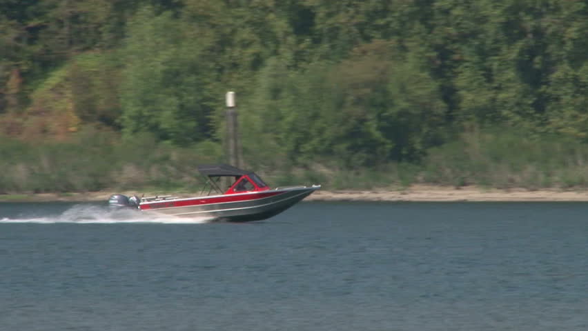 Fishing boat speeds by in the Columbia River Gorge.
