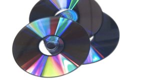 Computer CD DVD rotating on white background