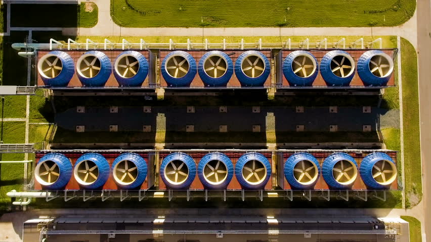 Cooling tower building with pump station at below in power plant. Aerial view