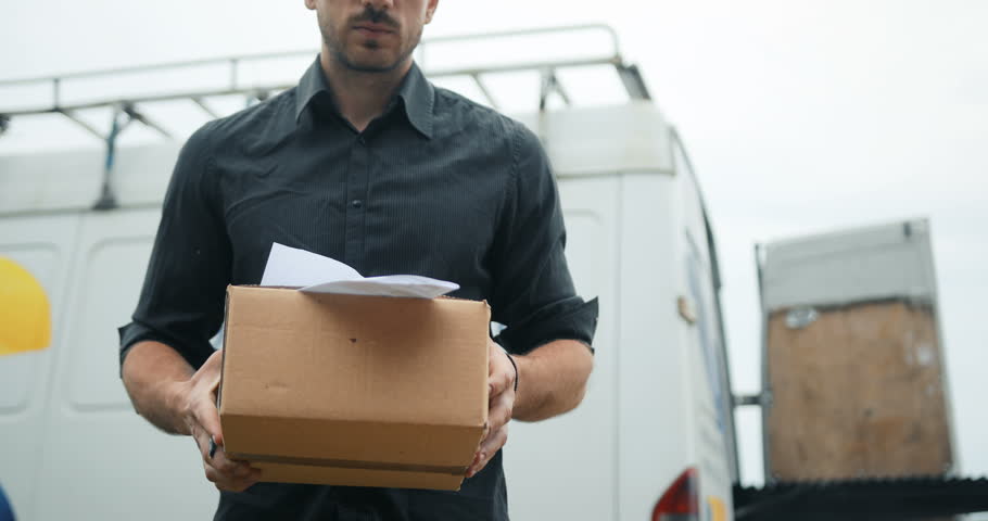 Delivery man delivering package to customer, close up at and and box Royalty-Free Stock Footage #28411741