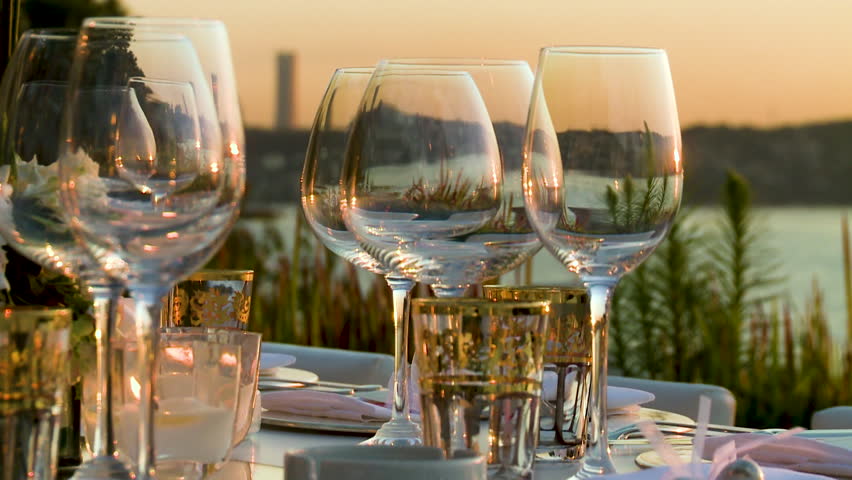 glases on tables at sunset
