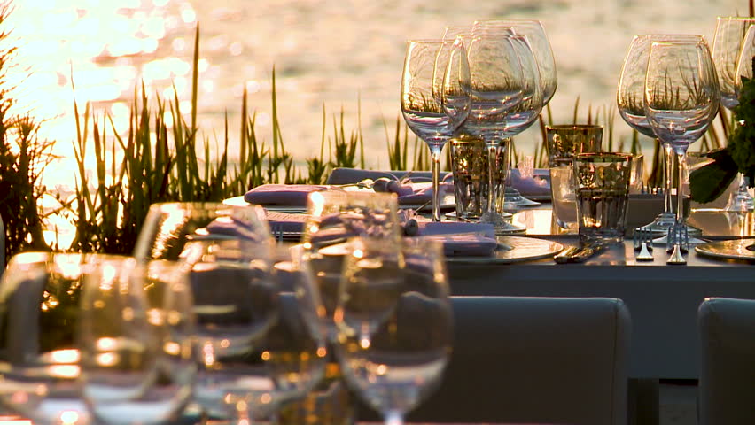 glases on tables at sunset