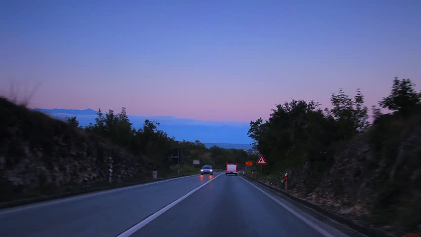 Car driving through countryside time lapse