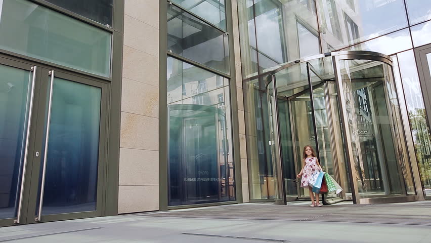 Cute little girl on shopping. Portrait of a kid with shopping bags. Shopping. girl.
