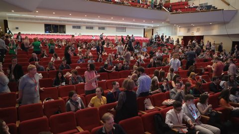 Novosibirsk Russia - May 20 2017: Listeners on learning conference or culture show. Leisure or convention for satisfaction and discussion. Big crowd enters hall and takes places. All seats are busy