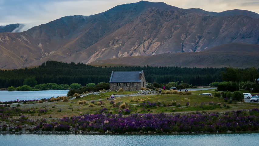 Lake Tekapo and Church of The Good Shepherd, New Zealand in Time Lapse in Summer. Landscape, Mountains and Nature.