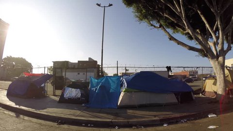 Los Angeles, California, USA - July 4, 2017:  Homeless tents along gritty San Pedro Street in the downtown Skid Row district. 