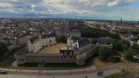 Aerial view of cityscape of Nantes, fort Chateau de Nantes, famous Cathedral of St. Peter and St. Paul - Normandy, France, 4k UHD  