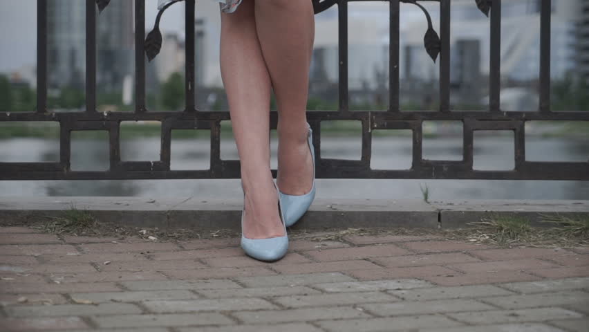 Crop woman holding dress