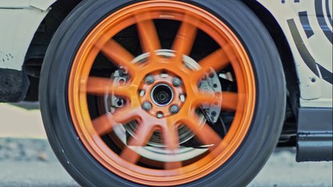 Closeup on the drifiting wheel of professional race car