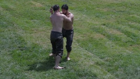 ISTANBUL,TURKEY,May 13,2017:Unidentified oil wrestlers.Oil wrestling (Yagli Gures),also called grease wrestling,is Turkish national sport.The wrestlers douse themselves with olive oil.
