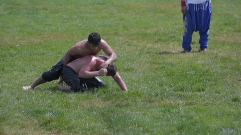 ISTANBUL,TURKEY,May 13,2017:Unidentified oil wrestlers.Oil wrestling (Yagli Gures),also called grease wrestling,is Turkish national sport.The wrestlers douse themselves with olive oil.