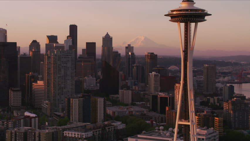Seattle, Washington circa-2017, Aerial view of Seattle at sunrise with Space Needle and Mt. Rainier. Shot with Cineflex and RED Epic-W Helium.