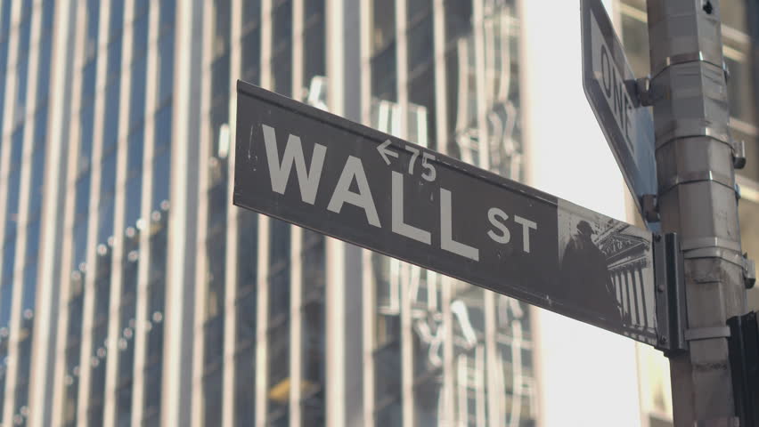 CLOSE UP: Street sign of iconic Wall Street, a collective name for the financial and investment community, stock exchanges, large banks, brokerages, securities, underwriting firms and big businesses Royalty-Free Stock Footage #28479091