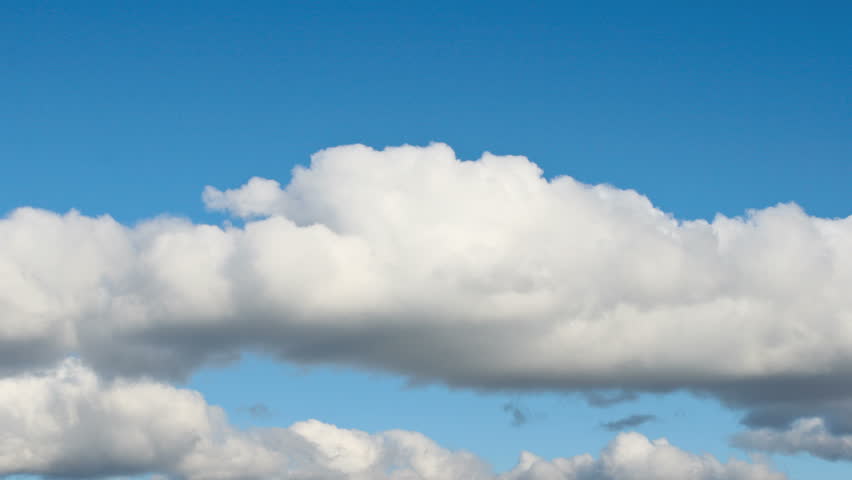 Beautiful white puffy clouds racing over Maine. 