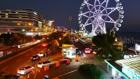 Pasay, Manila, Philippines – March 10, 2017: Time lapse of SM Mall of Asia area at night time. it is a shopping mall and popular tourists destination in Bay City, Pasay, Metro Manila.