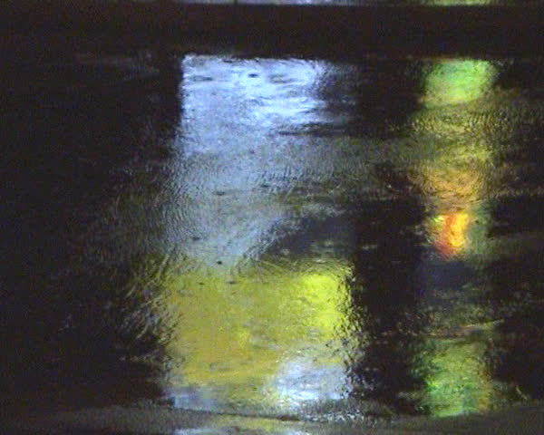 Heavy rain flooding urban street.