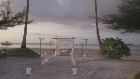 Drone over Beach Wedding Canopy into Sunset 4K D-Log