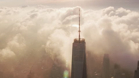 New York City circa-2017, Sunrise over Manhattan with clouds passing One World Trade Center building. Shot with Cineflex and RED Epic-W Helium.