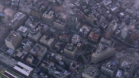 New York City circa-2017, Aerial view of Manhattan with low clouds at sunrise. Shot with Cineflex and RED Epic-W Helium.