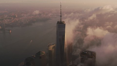 New York City circa-2017, Sunrise over Manhattan with clouds passing One World Trade Center building. Shot with Cineflex and RED Epic-W Helium.