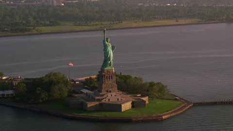 New York City circa-2017, Aerial view of Statue of Liberty at sunrise, Manhattan. Shot with Cineflex and RED Epic-W Helium.