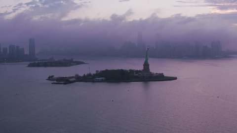 New York City circa-2017, Fly by Statue of Liberty on approach to Manhattan in early morning. Shot with Cineflex and RED Epic-W Helium.
