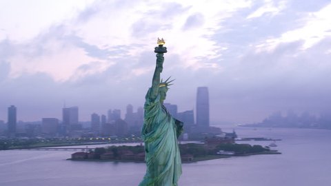 New York City circa-2017, Aerial orbit of Statue of Liberty at sunrise. Shot with Cineflex and RED Epic-W Helium.