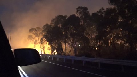 Australia-2010s: POV from a car during a massive wildfires in Australia.