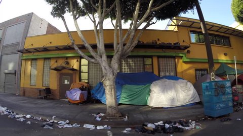 Los Angeles, California, USA - July 4, 2017:  Homeless tents along gritty San Pedro Street in the Skid Row district. 