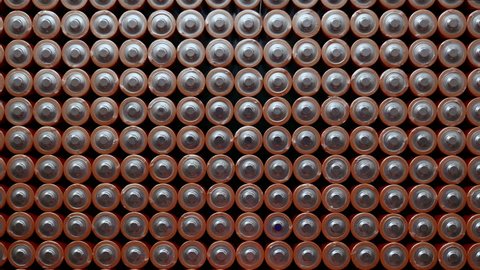 Energy abstract Background of Batteries. The top view of the Rows of AA Batteries. Used Alkaline Batteries