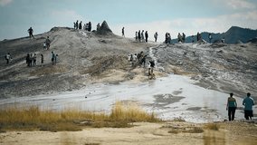 Tourists visiting mud volcanoes also known as mud domes in summer season