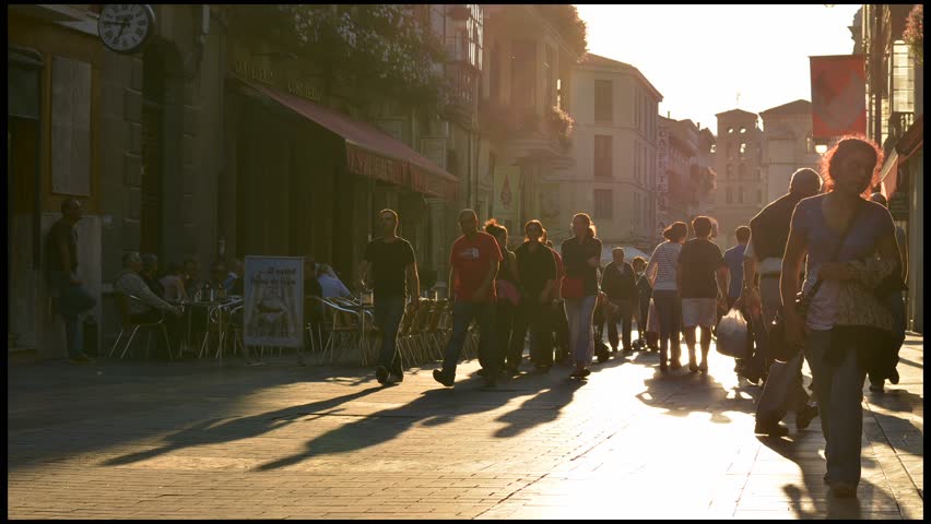 LEON, SPAIN - CIRCA JUNE 2012: Time lapse of people walking at sunset circa June