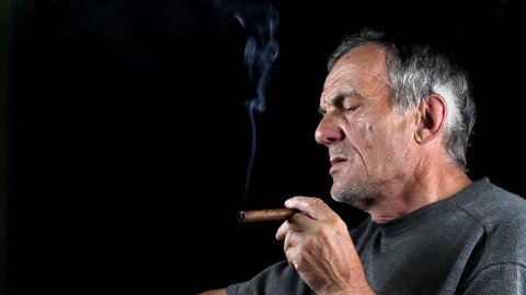 Man smokes cigar