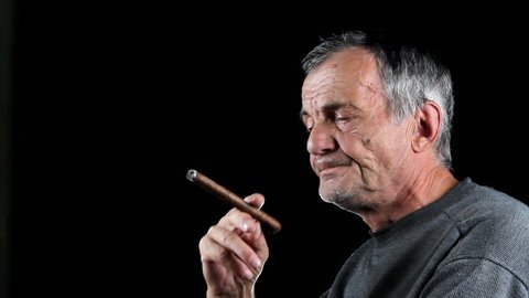 Man smokes cigar