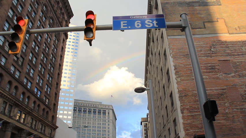 Cleveland Rainbow. Looking up at a rainbow behind the 6th Street sign at Euclid