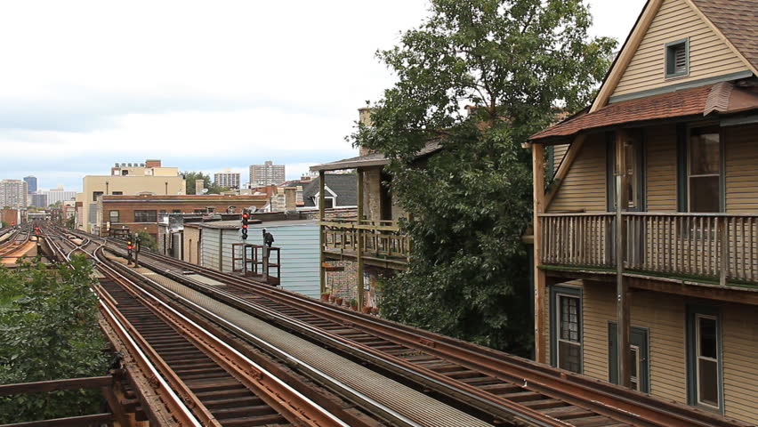 Chicago L Train. Chicago elevated rail passing closely to apartments near the