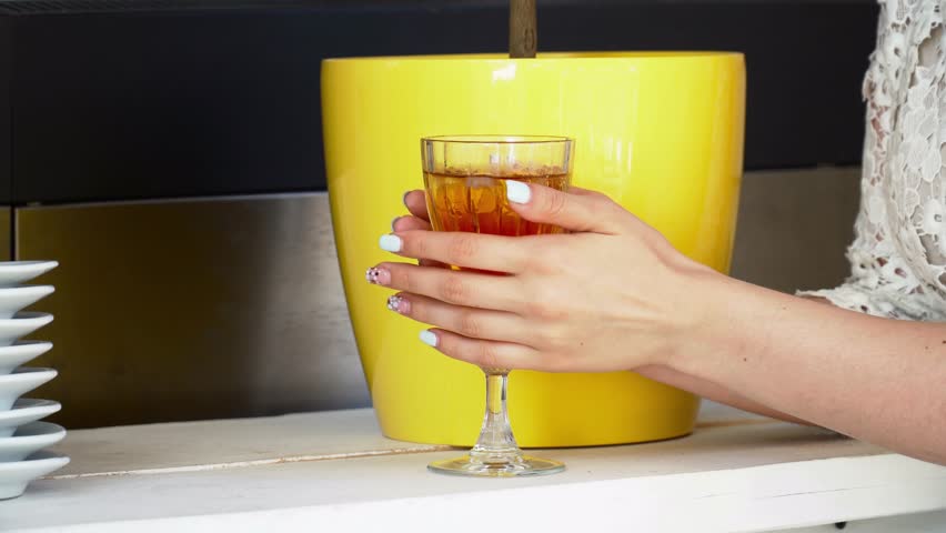 Beautiful young woman drinking cocktail on bar closeup
