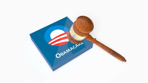 WASHINGTON - JULY 5, 2017: Plate with Obama Care affordable healthcare act logo being crashed with Judge's Gavel (Hammer). 