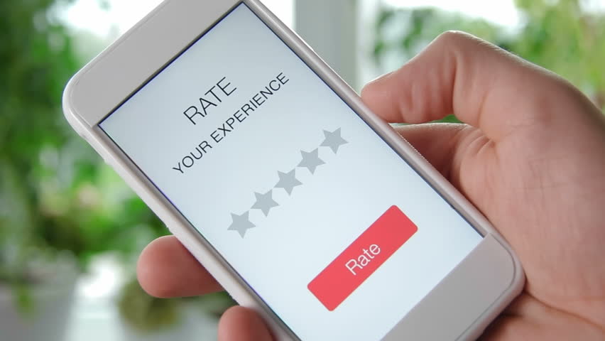 Man gives one star rating using smartphone application Royalty-Free Stock Footage #28552780