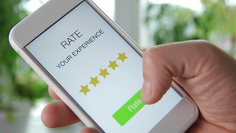 Man gives five star rating using smartphone application