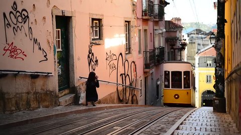 Tram in Lisbon coming up on a narrow gauge rails within the city, Lisbon, Portugal, Europe, Elevador da Bica