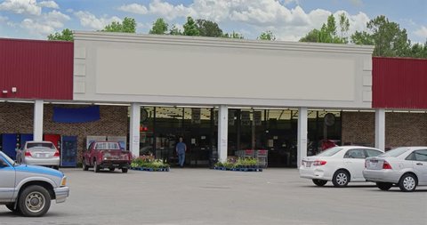 A daytime exterior DX establishing shot of an unbranded, generic grocery store. Blank marquee for customization.	