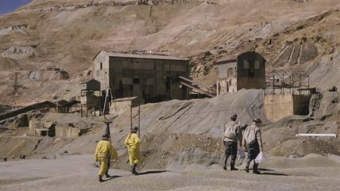 Group of miners returning to work after a meal break. Old mining installation in Potosi, Bolivia