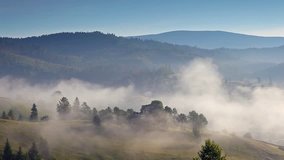 Bright rolling countryside covered with fog. Picturesque day and gorgeous scene. Location place Carpathian mountains, Ukraine, Europe. Explore the world's beauty. Shooting in HD 1080 video.