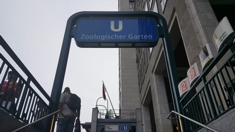 GERMANY - CIRCA JUNE 2017 - U Zoologischer Garten sign at entrance to Ubahn station, German flag, stairs