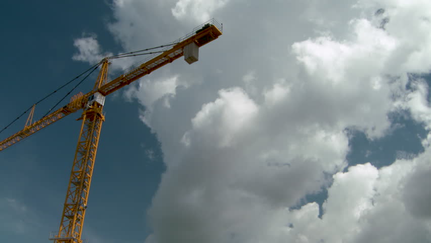 construction crane against sky with clouds