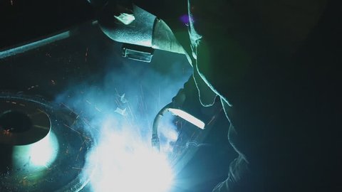 Metal Welding with sparks and smoke in  manufacturing